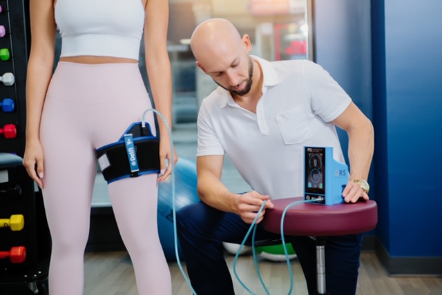 Blood flow restriction therapy session in clinic